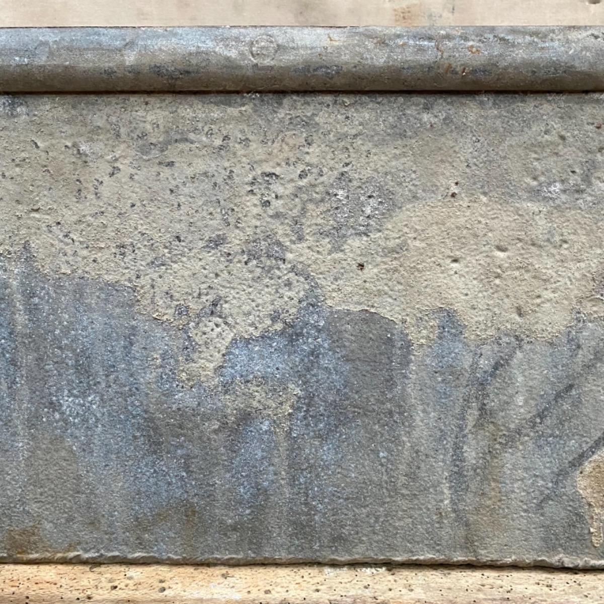 Large riveted metal trough