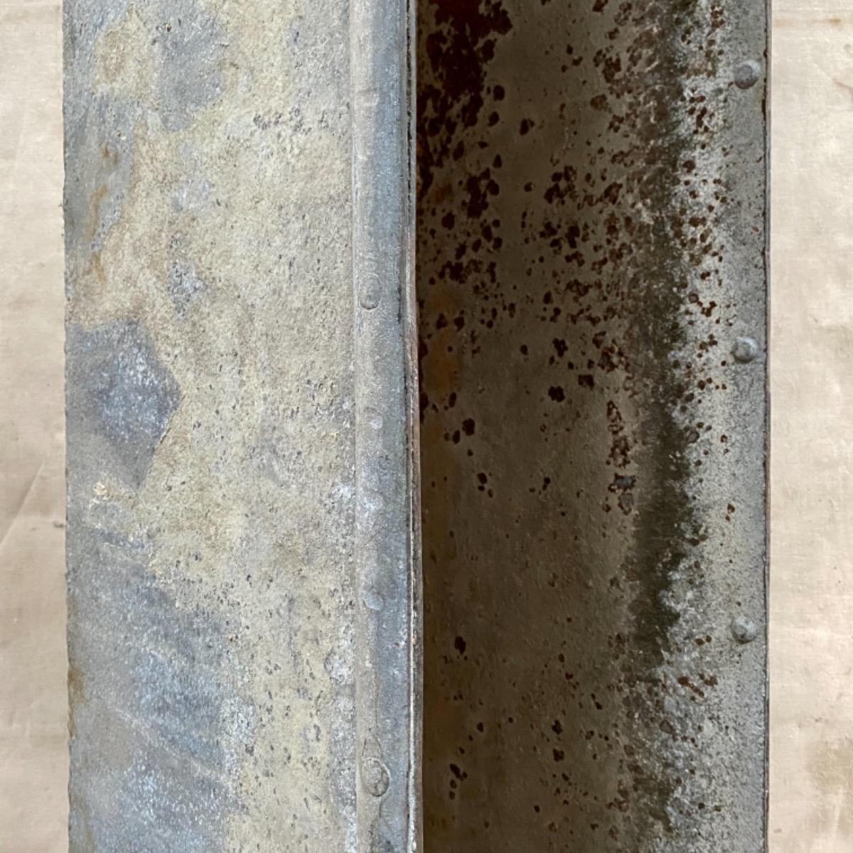 Large riveted metal trough