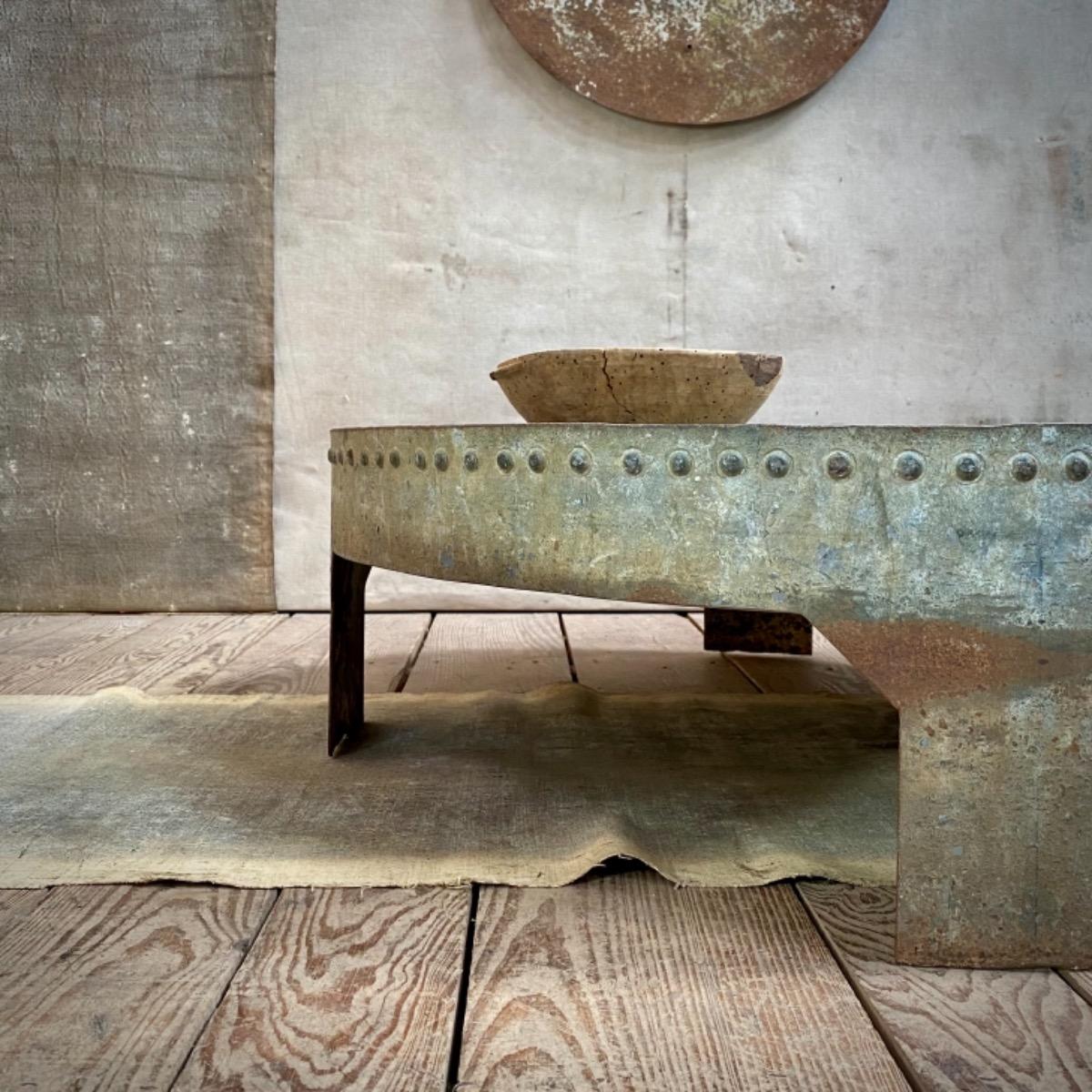 Riveted metal table