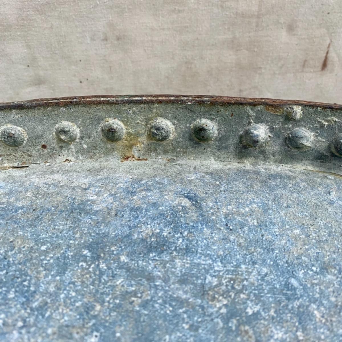 Riveted metal table