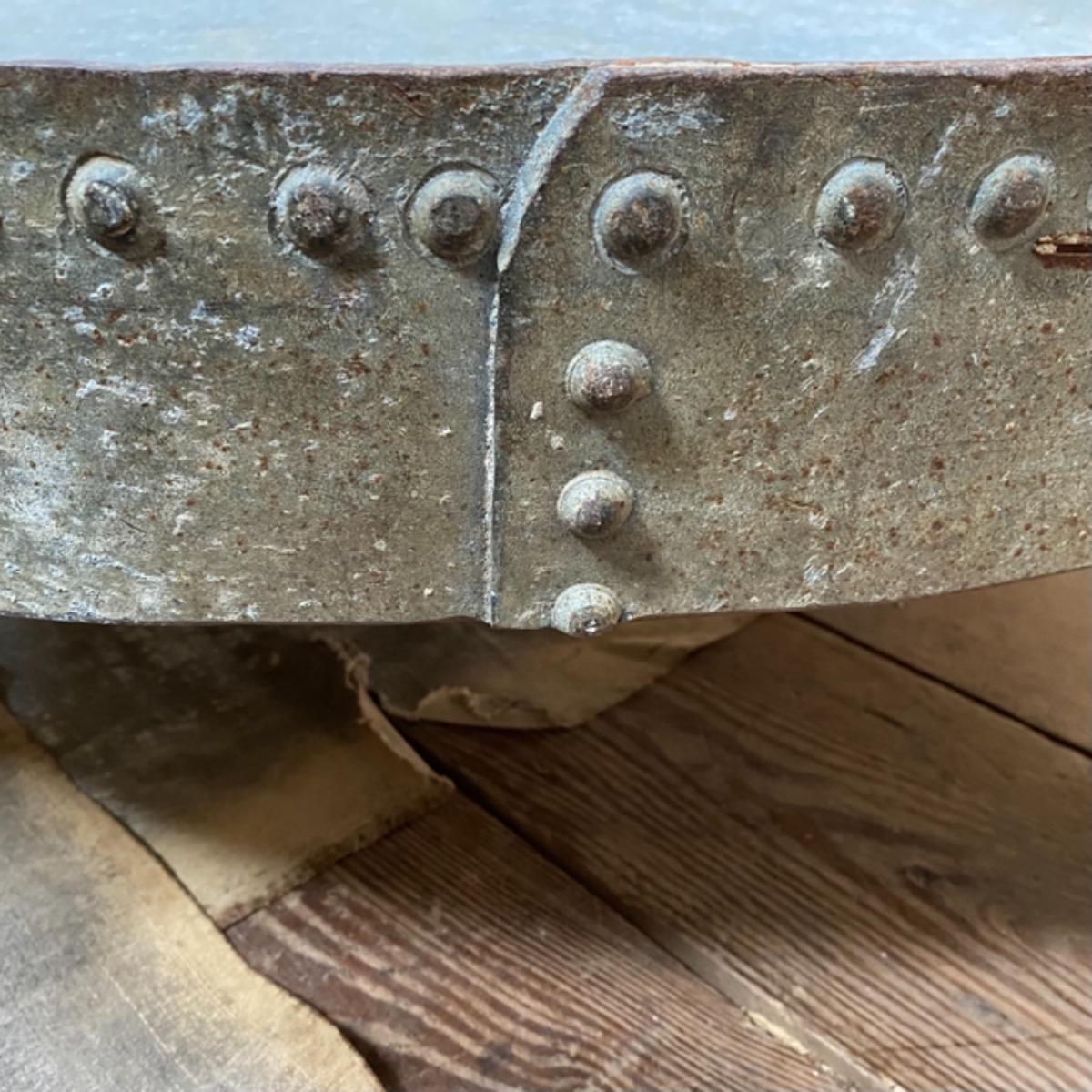 Riveted metal table